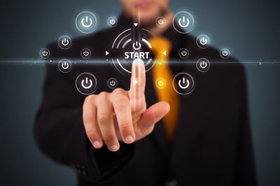 Businessman pressing simple start buttons on a virtual background