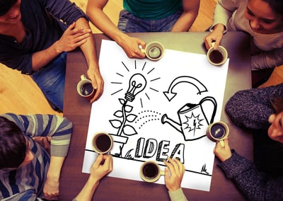 Composite image of idea and innovation graphic on page with people sitting around table drinking coffee