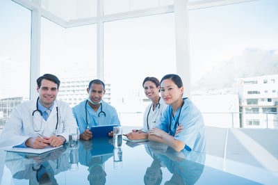 Group portrait of young doctors in a meeting at hospital