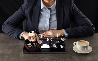 Business woman working on tablet with application and cloud technology concept