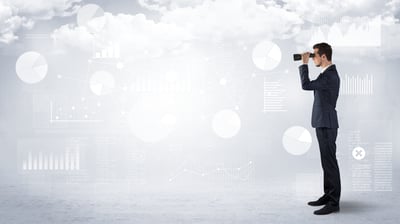 Businessman looking forward with binoculars cloudy background and graphs, charts around