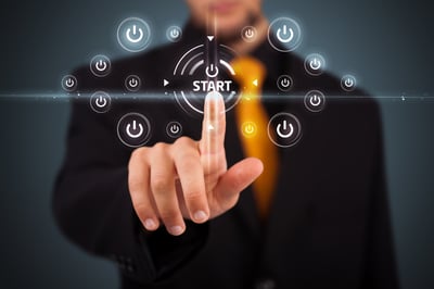 kaizen project presentation A conceptual image of a business man pressing a "Start" button.