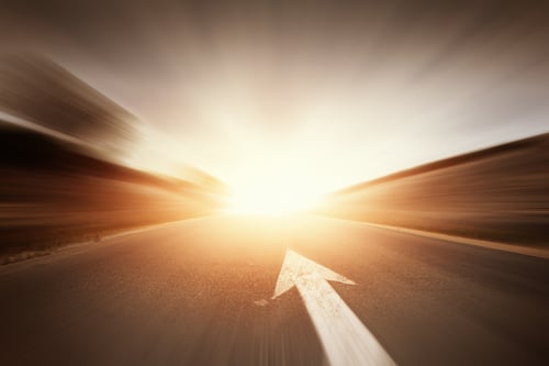 Conceptual image of asphalt road and direction arrow