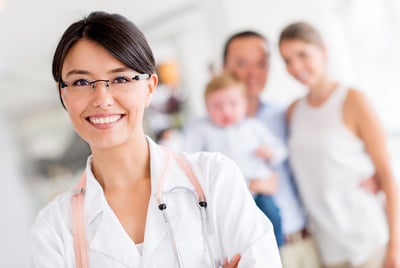 Friendly family doctor at the hospital looking happy