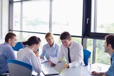 Group of happy young  business people in a meeting at office