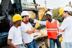 Group of workers talking at a building site .jpeg