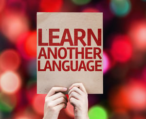 Learn Another Language card with colorful background with defocused lights.jpeg