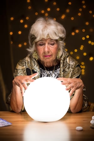 Old fortune teller sees a future from the crystal ball.jpeg