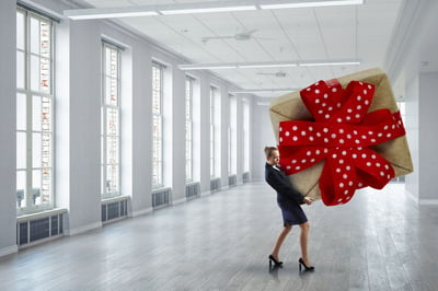 Woman with large giftwrapped box.