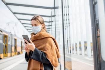 Woman wearing a mask in public