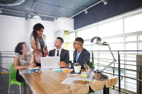 team of successful business people having a meeting in executive sunlit office-2